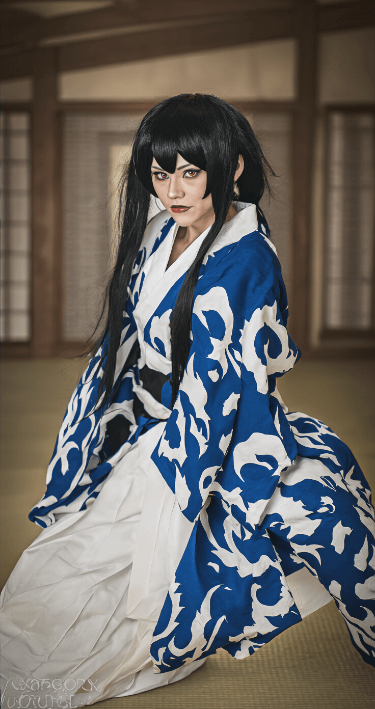 Sukuna Cosplay: Transform Into Jujutsu Kaisen's King of Curses (Complete 2024) A dynamic Sukuna cosplay in action, showcasing powerful poses and intense expressions in a modern dojo setting, with dramatic side lighting accentuating the full costume and character presence.