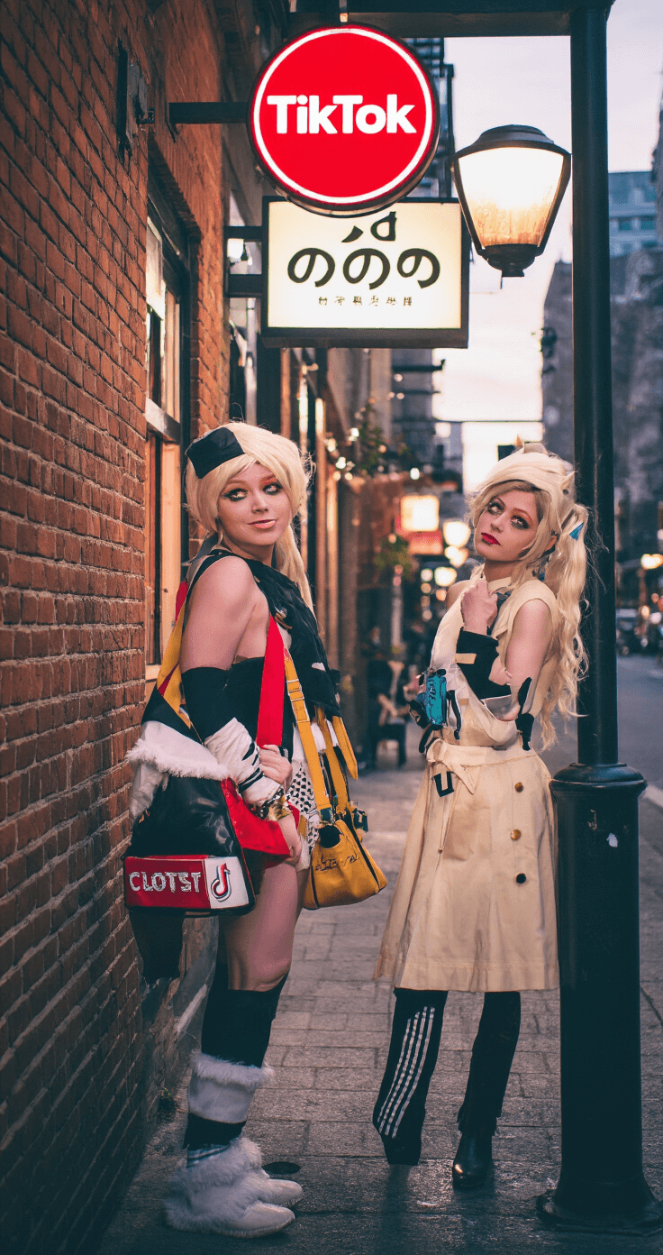 The Ultimate Guide to Duo Halloween Costumes: Creative Ideas That'll Turn Heads Dusk urban scene featuring a TikTok-inspired duo in trendy costumes against a brick wall, illuminated by cafe lights and streetlamps. Includes authentic props and branded accessories, with visible behind-the-scenes lighting setup. Captured with a Sony A7III and 35mm prime lens for a street photography vibe.