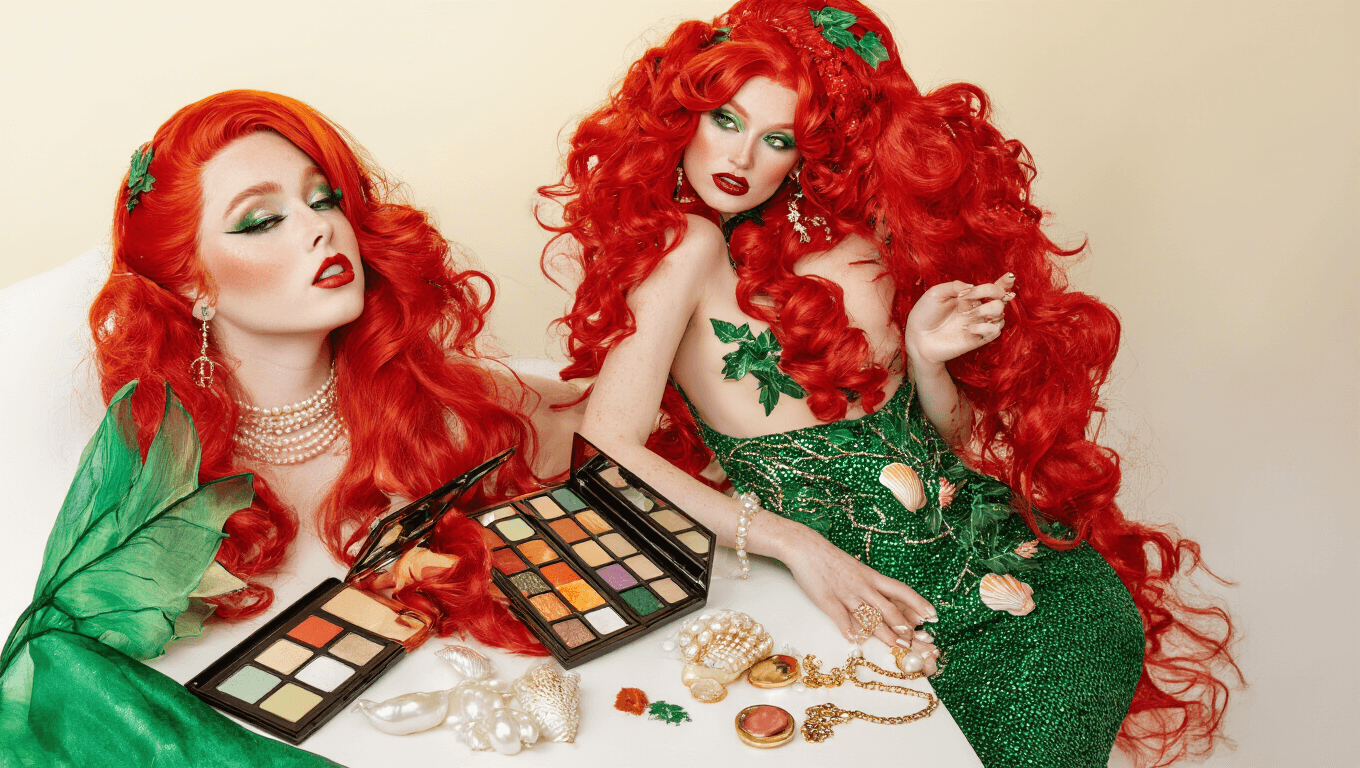 A vibrant Halloween costume collection on a white background, featuring red wigs, an emerald green mermaid tail, a red sequin gown, a green bodysuit with ivy details, and various accessories, all styled under warm golden lighting.