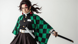 Detailed Tanjiro cosplay costume featuring a green and black checkered haori, black uniform with white belt, burgundy Hanafuda earrings, foam Nichirin sword, textured leg wraps, and a burgundy-black wig, all arranged on a white background with warm studio lighting.